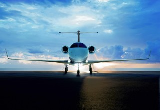 Phenom300--backview of plane on runway, wideshot