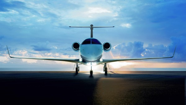 Phenom300--backview of plane on runway, wideshot