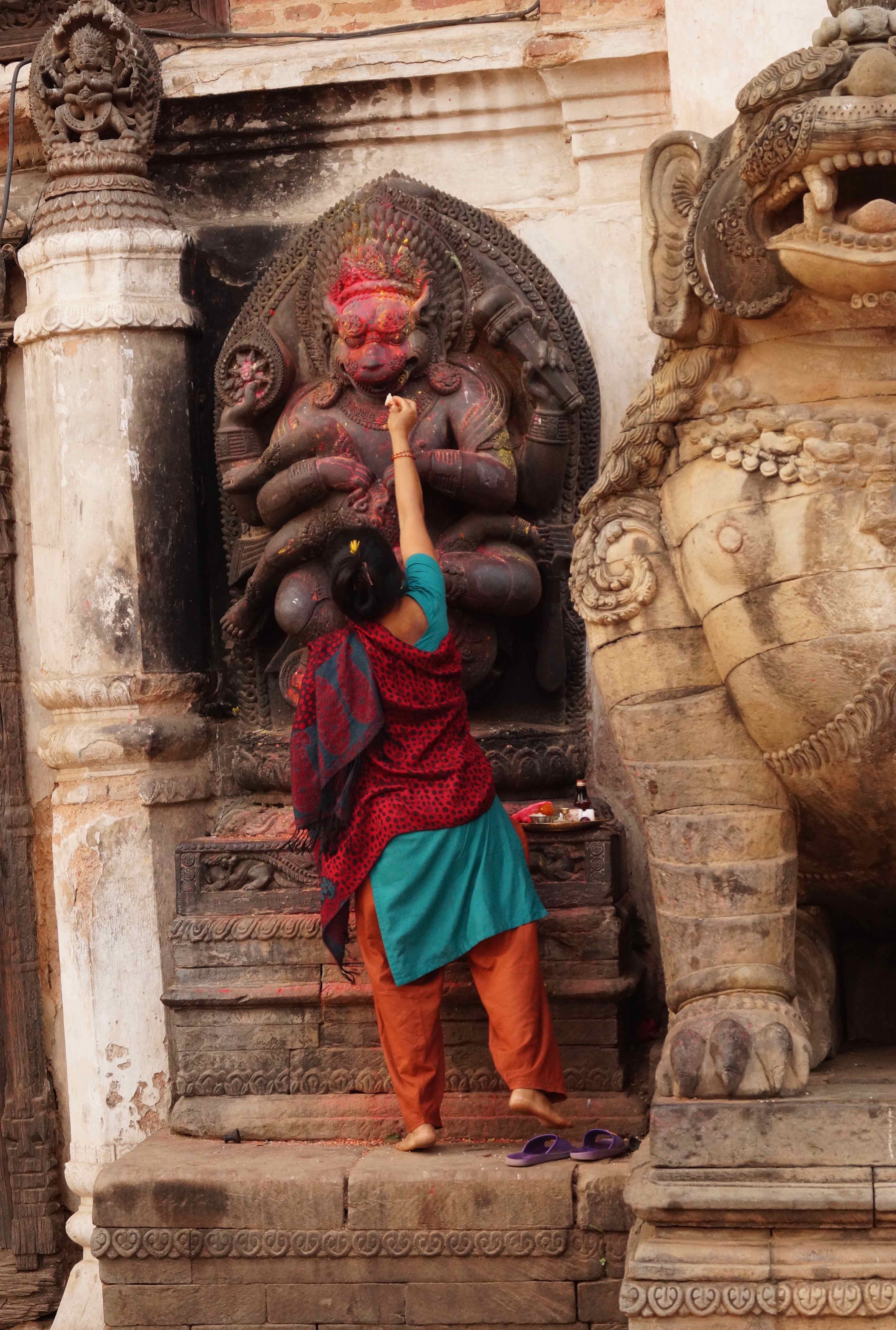 Offering to the Monkey God Hanuman on Durbar Square, Kathmandu Nepal