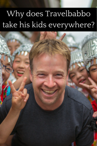 Why does Travelbabbo takes his kids everywhere?